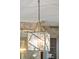 Detailed lighting fixture with glass and metal frame in the dining room at 11 Church St, Charleston, SC 29401