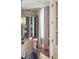 Dining room with detailed wallpaper, modern pendant lighting, and sheer mauve curtains at 11 Church St, Charleston, SC 29401