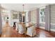 Dining room showcases a rustic table, upholstered chairs, elegant lighting, and wall coverings at 11 Church St, Charleston, SC 29401