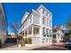 Charming three-story Charleston-style home with double porches and gray shutters at 11 Church St, Charleston, SC 29401
