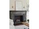 Close up of the living room fireplace with beautiful mantel and decor at 11 Church St, Charleston, SC 29401
