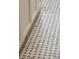 Close-up of Basketweave tile floor with light gray and white finish at 11 Church St, Charleston, SC 29401