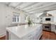 Bright open kitchen boasts a large marble-top island with views of the range at 11 Church St, Charleston, SC 29401