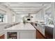 Bright and open kitchen featuring a large marble-top island with bar stool seating at 11 Church St, Charleston, SC 29401