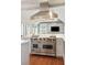 Bright open kitchen boasts stainless steel appliances including professional Viking range and ovens at 11 Church St, Charleston, SC 29401