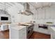 Bright kitchen with marble countertops, brick accent wall, and stainless Viking range at 11 Church St, Charleston, SC 29401