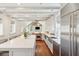 Bright and airy kitchen with large island, marble counters, wooden floors, and stainless appliances at 11 Church St, Charleston, SC 29401