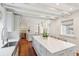 Bright kitchen features marble countertops, stainless steel appliances, and hardwood floors at 11 Church St, Charleston, SC 29401