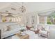 Spacious living room features exposed brick wall, hardwood floors, and natural light at 11 Church St, Charleston, SC 29401