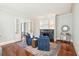 Cozy living room showcases armchairs, fireplace, hardwood floors and a decorative rug at 11 Church St, Charleston, SC 29401
