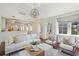Spacious living room features exposed brick wall, hardwood floors, and natural light at 11 Church St, Charleston, SC 29401