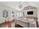 Bright living room with exposed brick, hardwood floors, and contemporary furnishings at 11 Church St, Charleston, SC 29401