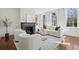 Bright living room with a fireplace, hardwood floors, and natural light at 11 Church St, Charleston, SC 29401