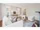 Elegant living room with white sofa, chairs, wooden floors, and stylish decor at 11 Church St, Charleston, SC 29401