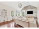 Spacious living room features exposed brick wall, hardwood floors, and natural light at 11 Church St, Charleston, SC 29401