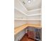 Spacious pantry with wooden countertops, stainless steel mini-fridge, and white wall shelving at 11 Church St, Charleston, SC 29401