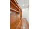 Spacious walk-in closet with custom wood shelving and drawers, plus hardwood floors at 11 Church St, Charleston, SC 29401