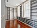 Custom walk-in closet with gray shelving and hardwood floors near bright windows at 11 Church St, Charleston, SC 29401