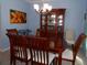 Formal dining room with chandelier, wood table, china cabinet, and beautiful decor at 113 Mayfield Dr, Goose Creek, SC 29445