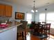 Eat-in kitchen with granite counters, bar seating, and dining table at 113 Mayfield Dr, Goose Creek, SC 29445