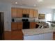 Modern kitchen featuring stainless steel appliances, granite countertops, and hardwood floors at 113 Mayfield Dr, Goose Creek, SC 29445