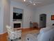 Cozy living room features an electric fireplace, ceiling fan, and comfortable seating area at 113 Mayfield Dr, Goose Creek, SC 29445