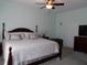 Spacious main bedroom with a ceiling fan, large bed, and ample natural light at 113 Mayfield Dr, Goose Creek, SC 29445