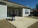 Relaxing covered patio featuring a grill, air conditioner, and seating at 113 Mayfield Dr, Goose Creek, SC 29445