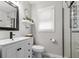 Bright bathroom with decorative floor tiles, a glass shower, and modern fixtures at 116 Lyle Rd, Goose Creek, SC 29445