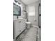 Well-lit bathroom features decorative floor tiles, a glass shower, and a stylish vanity at 116 Lyle Rd, Goose Creek, SC 29445