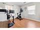 Bedroom featuring a desk, chair, exercise bike, wood floors, and 2 windows at 116 Lyle Rd, Goose Creek, SC 29445