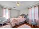 Inviting bedroom featuring a bed with pink accents, hardwood floors, and lots of natural light at 116 Lyle Rd, Goose Creek, SC 29445