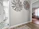 Hallway featuring windmill art on the walls leading to a glimpse of a bathroom and bedroom at 116 Lyle Rd, Goose Creek, SC 29445