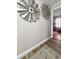 Hallway with windmill wall art leading to a glimpse of a bedroom at 116 Lyle Rd, Goose Creek, SC 29445