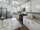A well-equipped kitchen has granite counters and stainless steel appliances at 116 Lyle Rd, Goose Creek, SC 29445