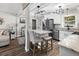 Modern eat-in kitchen boasts stainless appliances, granite counters, and stylish lighting at 116 Lyle Rd, Goose Creek, SC 29445