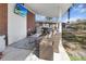 Covered outdoor patio with ample seating, an area rug and a television set for entertainment at 116 Lyle Rd, Goose Creek, SC 29445