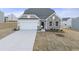 Charming single-Gathering home featuring a two-car garage and stone facade at 119 Palfrey Dr, Ridgeville, SC 29472