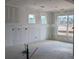 Large, unfinished room showing multiple windows revealing the spaciousness and natural light available in this blank canvas at 119 Palfrey Dr, Ridgeville, SC 29472