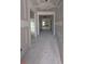 Unfinished interior hallway offering a glimpse into other rooms featuring white walls and trim awaiting personalization at 119 Palfrey Dr, Ridgeville, SC 29472