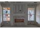 Unfinished living room with windows flanking a fireplace and chimney ready for customization with electrical wiring exposed at 119 Palfrey Dr, Ridgeville, SC 29472