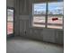 A bright and airy interior featuring a window and a glass door that offers beautiful views of the outdoors at 119 Palfrey Dr, Ridgeville, SC 29472