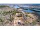 A forested area with road winding near a home's foundation and river at 1302 Mccrae Dr Dr, Moncks Corner, SC 29461