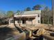 Under construction exterior featuring a covered porch and large windows, awaiting finishing touches at 1302 Mccrae Dr Dr, Moncks Corner, SC 29461