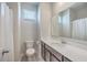 Bright bathroom features a vanity, mirror, and a shower with a white curtain at 131 Summer Tanager Dr, Ravenel, SC 29470