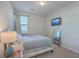 Well-lit bedroom with carpet, a TV, mirror, and a side table with a stylish lamp at 131 Summer Tanager Dr, Ravenel, SC 29470