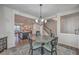 Open-concept dining area with views of the kitchen, island and staircase at 131 Summer Tanager Dr, Ravenel, SC 29470