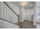 Welcoming entryway with hardwood floors, staircase, and closet space at 131 Summer Tanager Dr, Ravenel, SC 29470