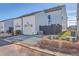 Exterior view of a modern home with a garage, dark fence, and well-maintained landscaping at 131 Summer Tanager Dr, Ravenel, SC 29470