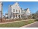 Attractive exterior of newly-built homes, showcasing pristine lawns, and well-maintained sidewalks at 131 Summer Tanager Dr, Ravenel, SC 29470